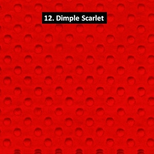 May include: Bright red fabric with a dimpled texture. The surface is covered in evenly spaced, raised circles. The text "12. Dimple Scarlet" is in a black rectangle in the top center of the image.