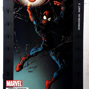 May include: Comic book cover for Ultimate Spider-Man, showing Spider-Man in action, entangled in webs. The cover has a dark backdrop with the title "Ultimate Spider-Man" and "Issue 74". The Marvel logo is present.