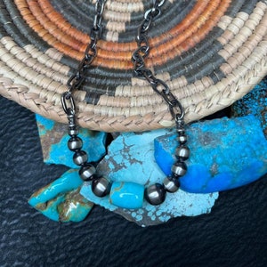Southwestern necklace featuring a beautiful Kingman turquoise barrel bead and sterling silver chain