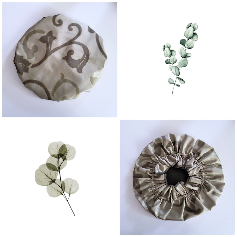 May include: Two shower caps with a floral pattern. One is a light brown with a dark brown floral pattern. The other is a light brown with a darker brown floral pattern. Both caps are made of satin.