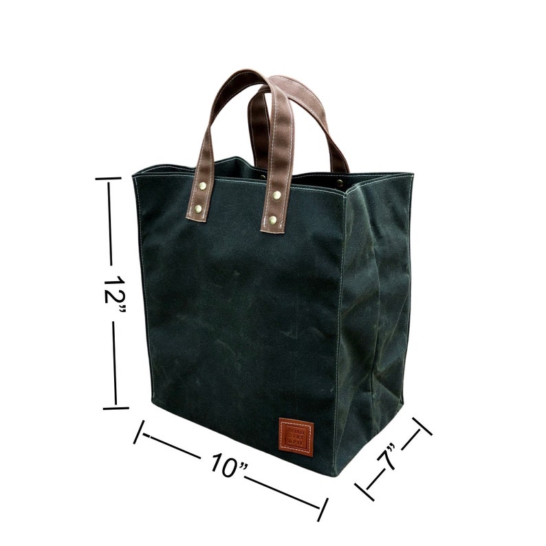 A reusable, waxed canvas market tote, dimensional image. 10 inches wide, 7 inches deep, and 12 inches tall. Eco-Friendly Waxed canvas stands up on its own, and is naturally weather resistant. Handcrafted in the USA.