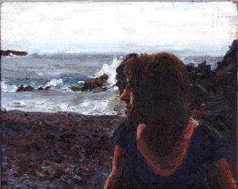 Woman on the beach at dusk