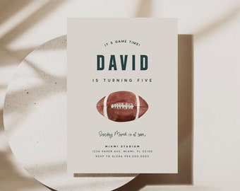 May include: A beige invitation card with a brown football illustration. The text on the card reads "It's game time! David is turning five. Sunday March 14 at 3pm. Miami Stadium 1234 Paper Ave, Miami, FL 33100 RSVP to Alexa 788-000-0000"