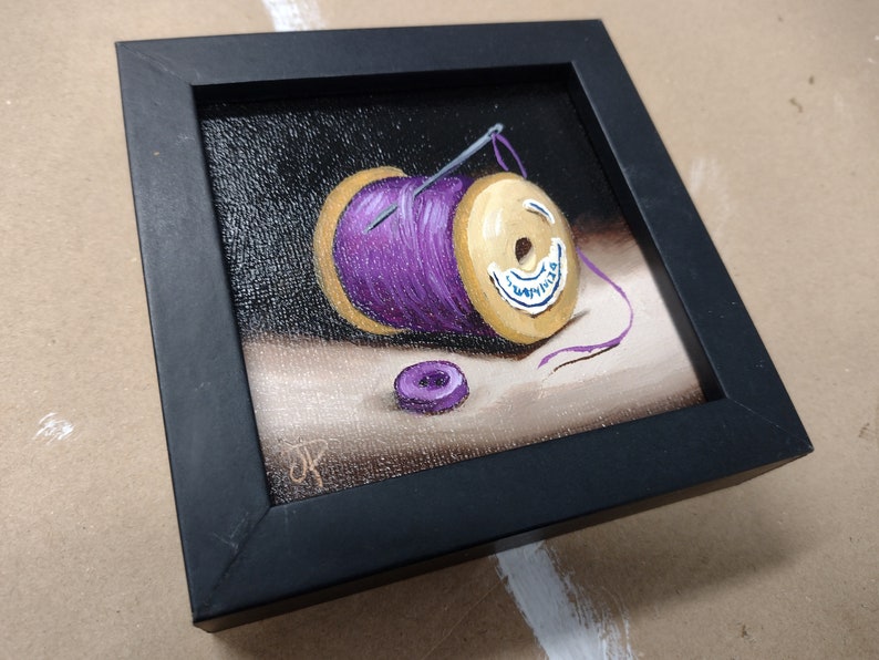 Little Needle and thread Purple cotton reel Original still life Oil Painting, by Jane Palmer Art Framed contemporary Realism artwork black framed