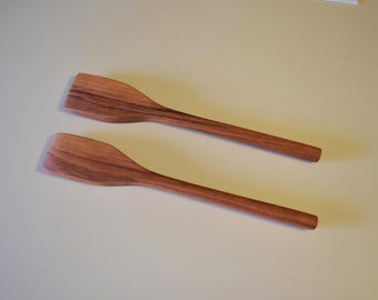 Two handmade cherry flipper/scrapers about 10 3/4 inches long, 1 3/4 inches wide.