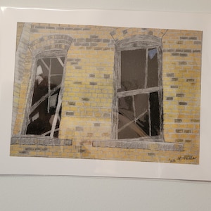May include: A drawing of a brick building with two windows. The windows are broken and have a lot of cracks in the glass. The bricks are yellow and the windows are black.
