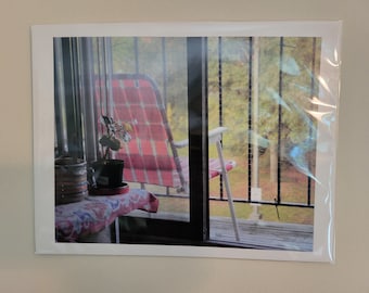 Original photograph of an empty chair on a balcony