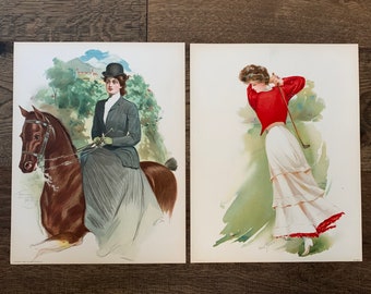 May include: Two vintage prints. One depicts a woman in a riding habit on a brown horse, set against a backdrop of a landscape. The other shows a woman in a red top and white skirt swinging a golf club on a green course.