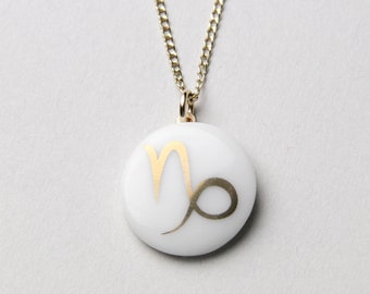 Capricorn porcelain pendant, gold, sign of the zodiac.