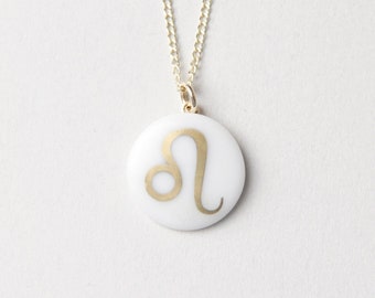 Leo porcelain pendant, gold, sign of the zodiac.
