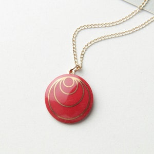 Red porcelain pendant, with gold circles. image 1