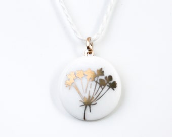 Snow-white porcelain pendant, gold wild flower