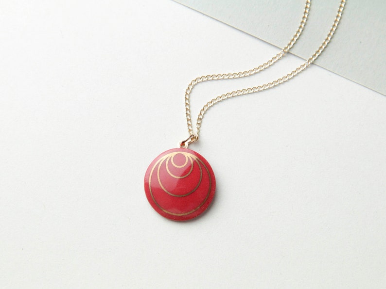 Red porcelain pendant, with gold circles. image 1