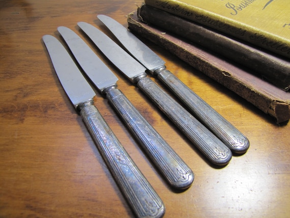 Four (4) Vintage 1881 Rogers Dinner Knives - Silver Plated Handles