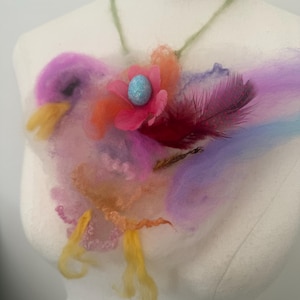Easter bird Art to wear neck piece. Needle Felted embellished crocheted necklace, flowers. Hand dyed wool locks. Art yarn.