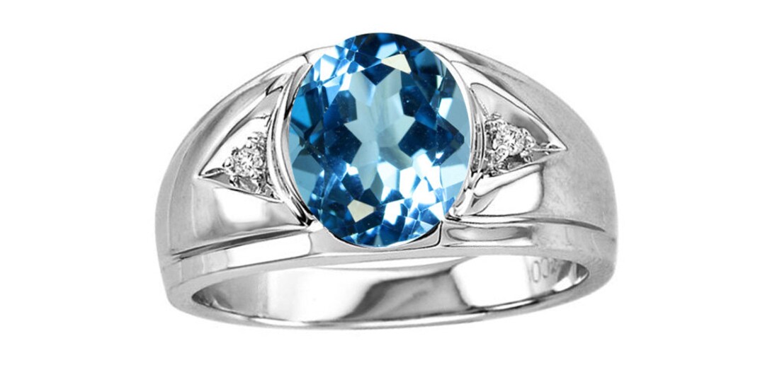 Sterling Silver 10x8mm Oval Genuine Blue Topaz W/ 2- 1.5 Ct