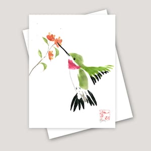 May include: A watercolor painting of a hummingbird with green and black feathers, hovering in mid-air and drinking nectar from a red flower. The background is white with a few scattered dots of orange paint.