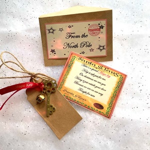 Una llave del Polo Norte SANTA KEY Jingle Bell Cinta Poema CHRISTMAS Eve Box Stocking Filler Glitter Magical Believe Tradicional Regalo Recuerdo
