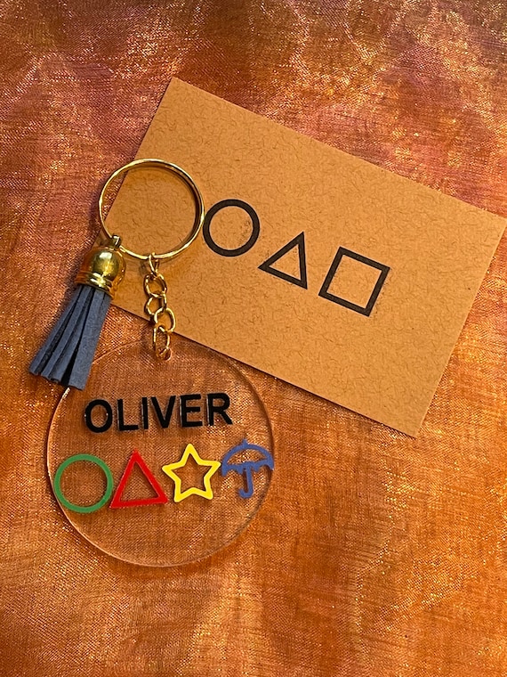 Personalised Squid Game inspired key ringor bag charm with the four shapes etc plus card and shiny bag fab stocking filler secret santa