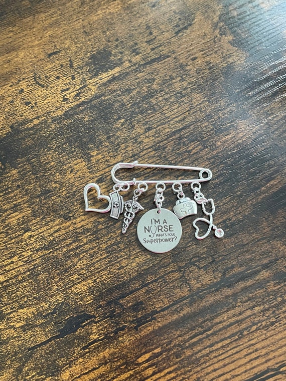 GRADUATE Fun Nurse Pin Bag Shirt Charm Set I’m a Nurse What’s your Superpower Medical Symbol Charm Stethoscope Hat Cross Gift Box Or Bag