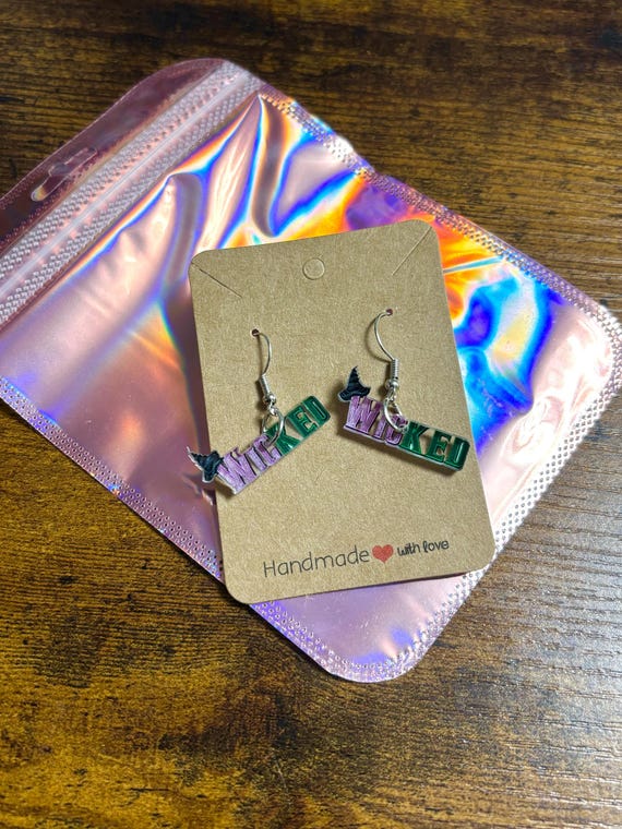 WICKED Pair Of Dangle Earrings Stainless Steel And Acrylic Pink Green Carded Pink Shimmer Gift Bag Film Inspired Witches Wizards Good Bad