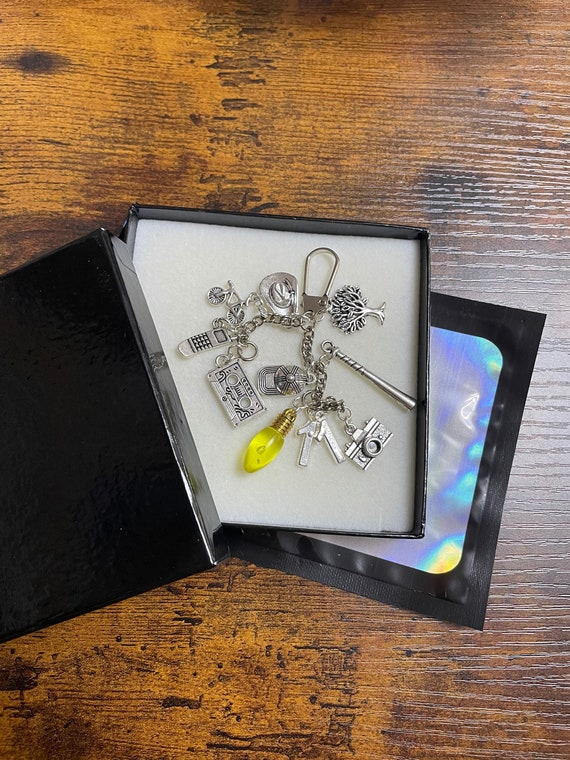 Stranger things film inspired key ring charm set light bulb 11 cowboy hat tape phone camera keepsake gift any occasion gift boxed fun quirky