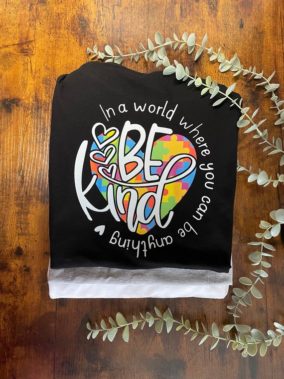 BE KIND In A World Where You Can Be Anything Vinyl Printed T Shirt Autism Keepsake Gift Hearts Jigsaws Quote Colourful Picture Quirky