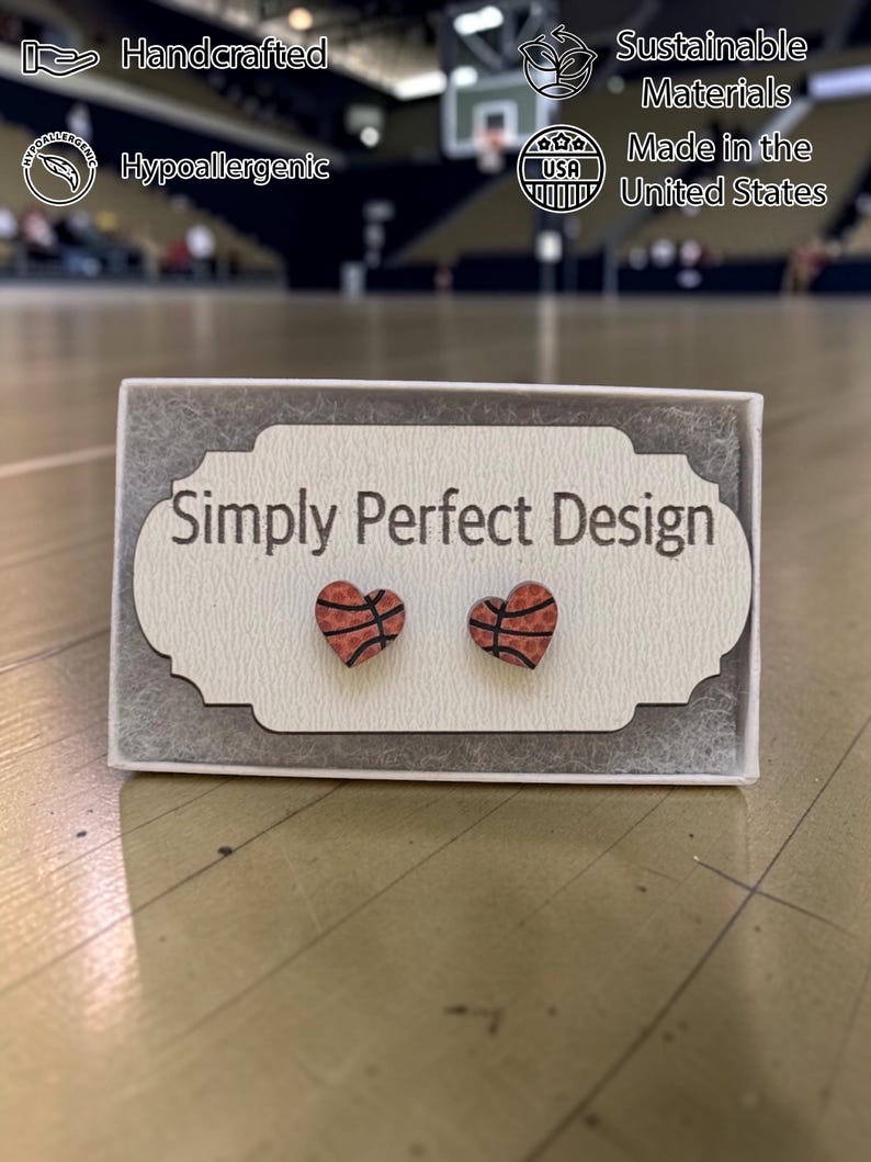 Basketball heart stud earrings on a card in a gift box on a court
