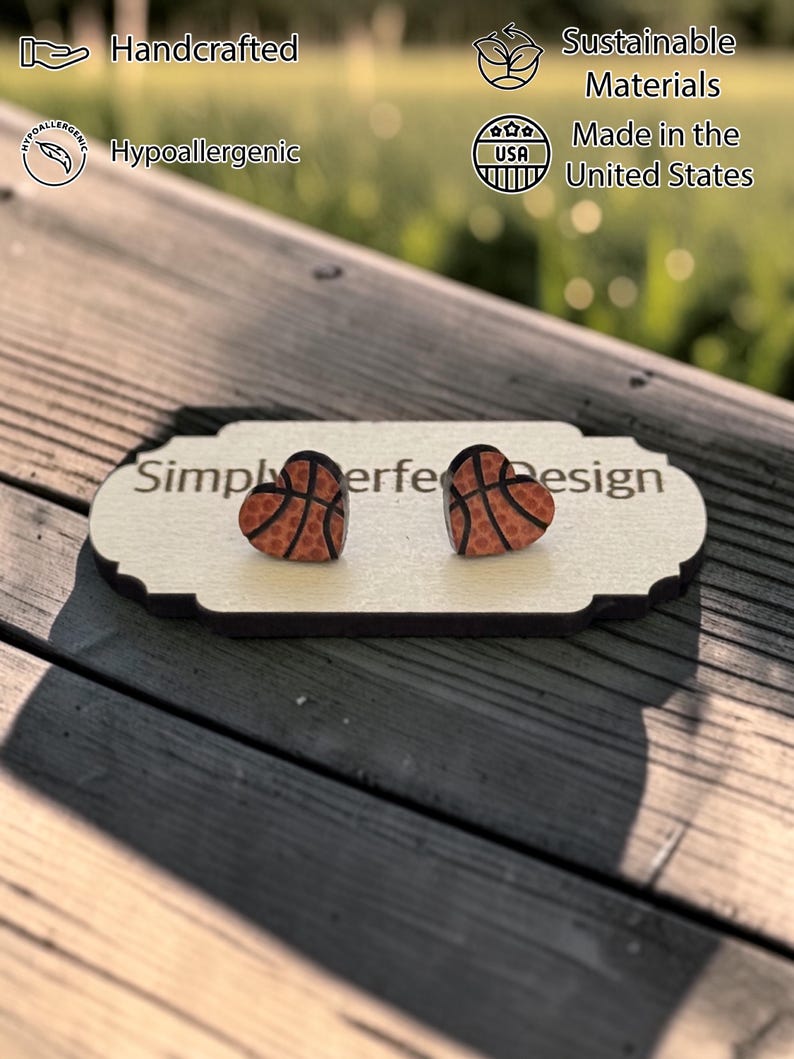 Basketball heart studs on a card on a wood bench