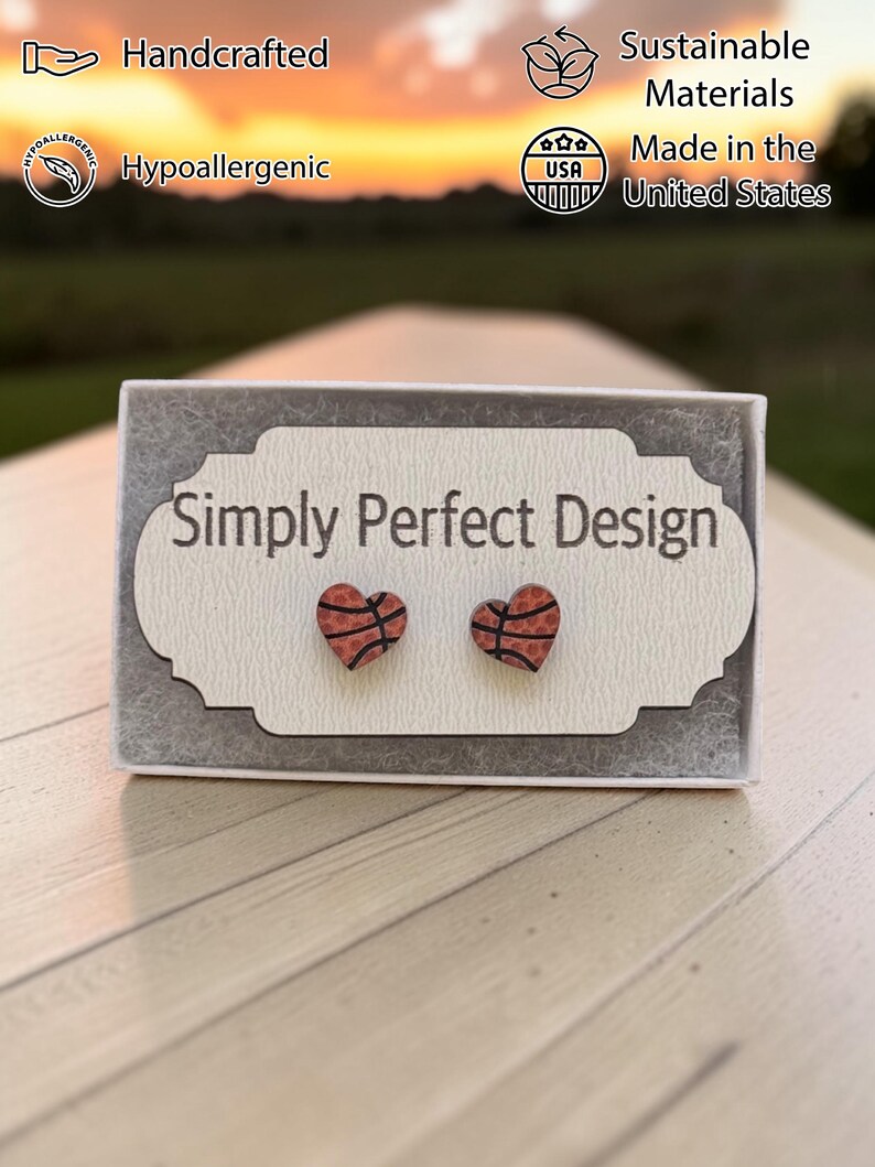 Basketball heart studs on a card in a gift box at sunset