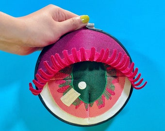 MARLOWE |  fiber art sculpture of pink and green eye, one-of-a-kind design handmade by artist, quirky wall decor, eye see you