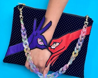 MARIVELOUS | Handmade clutch with shoulder strap and eye/hand surreal design. Dopamine Dressing for maximalist-lover!