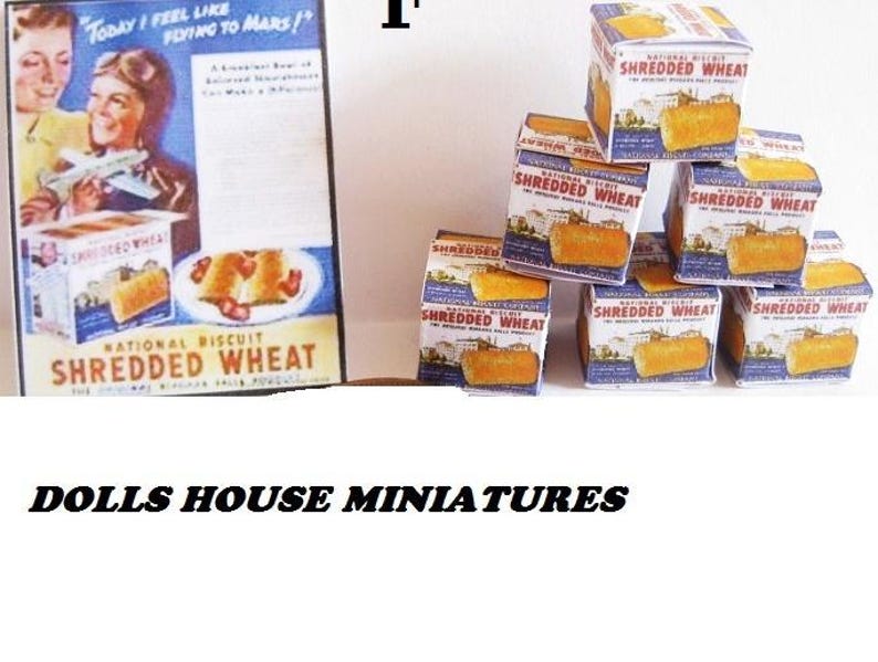 May include: A set of miniature boxes of National Biscuit Shredded Wheat cereal. The boxes are stacked in a pyramid shape and feature a vintage design with a red, white, and blue color scheme. The boxes are labeled "National Biscuit Shredded Wheat" and feature an image of a bowl of cereal.