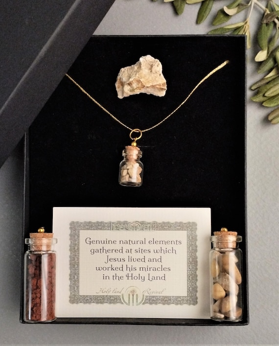 Relic pendant filled with tiny rocks from the Golgotha Calvary skull hill blessed at the anointing stone, Holy Sepulcher, Jerusalem