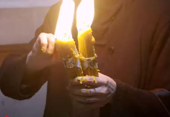 Holy Fire Candle lit at Easter at  Church of the Holy Sepulchre Jerusalem
