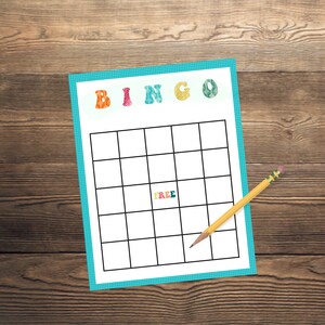 May include: A blank bingo card with a blue border and colorful letters spelling "BINGO" at the top. The card has a free space in the center and is ready for players to mark off squares.