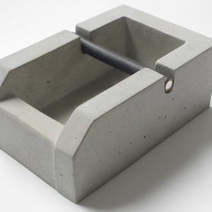 raw living knockbox made of concrete, espresso, knocking container