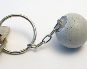 raw living key fob made of concrete