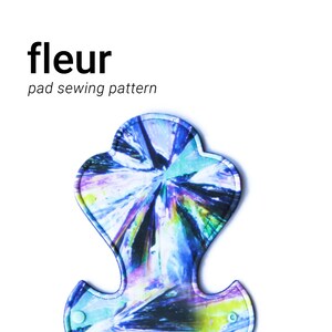 May include: A reusable pad sewing pattern with a vibrant, abstract design in shades of blue, purple, and yellow. The text "fleur" and "pad sewing pattern" are displayed in black font.
