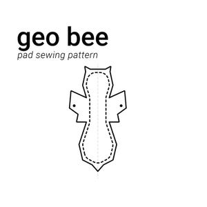 May include: A black and white line drawing of a sewing pattern for a reusable menstrual pad. The pattern is symmetrical and has a rounded shape with wings. The text "geo bee pad sewing pattern" is above the pattern.