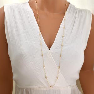 Long Gold Beaded Necklace. 36 Inch Necklace with Fine Chain and Spaced, Smooth Beads. Opera Length Station Necklace in 14Kt Gold Filled.