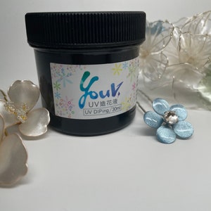 May include: A small black jar of UV resin for dipping flowers. The jar has a label that says "Your UV Diping/30ml" and "UV 過ぎ花液".