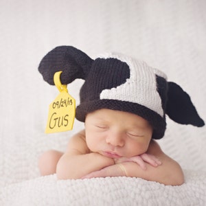 Original Knitted Newborn Cow Hat with identification and birthdate tag   Designed and created by Pamela Husereau