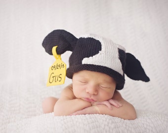 Original Knitted Newborn Cow Hat with identification and birthdate tag   Designed and created by Pamela Husereau