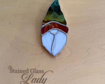 Handcrafted stained glass gnome Christmas ornament in green and red, unique seasonal gift tag, holiday home decor, white elephant