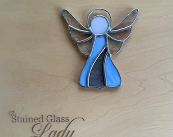 Handcrafted stained glass angel Christmas ornament in light and cathedral blue, holiday home decor, unique gift idea or party favor