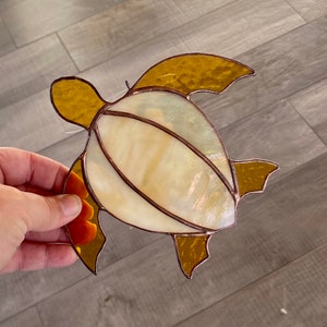 Handcrafted stained glass sea turtle in ivory and amber, beachy home decor, coastal gift idea, unique window or wall hanging