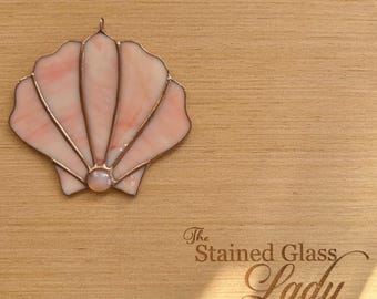 Handcrafted stained glass scallop shell suncatcher in flamingo pink, coastal window hanging
