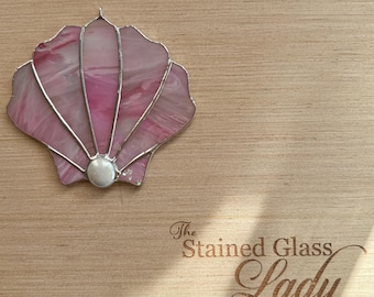 Handcrafted stained glass scallop shell suncatcher in iridescent pink, coastal gift idea