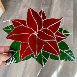 Handcrafted stained glass Christmas poinsettia suncatcher in red cathedral, holiday home decor or gift idea